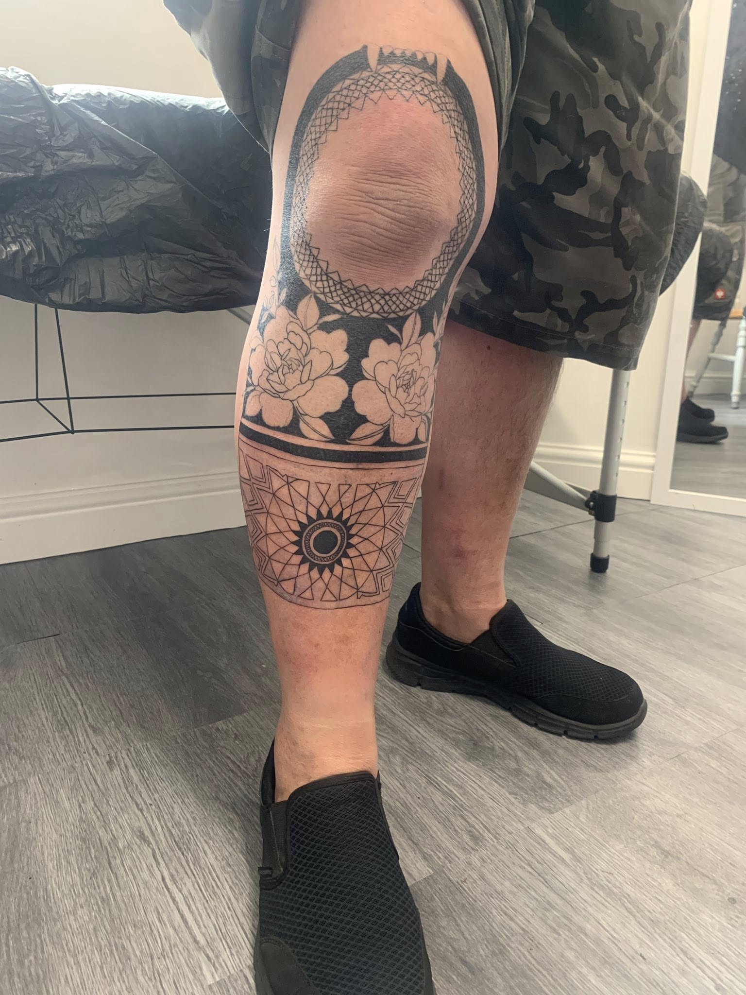 Delicate fine line symbol tattoo by Ink By LOLO Southport area